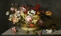 Bosschaert Ambrosius Fleurs dans un panier avec un oeillet une rose et un lézard sur une table